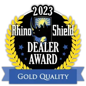 2023 Rhino Shield Dealer Award badge with gold laurel wreath and blue Gold Quality ribbon