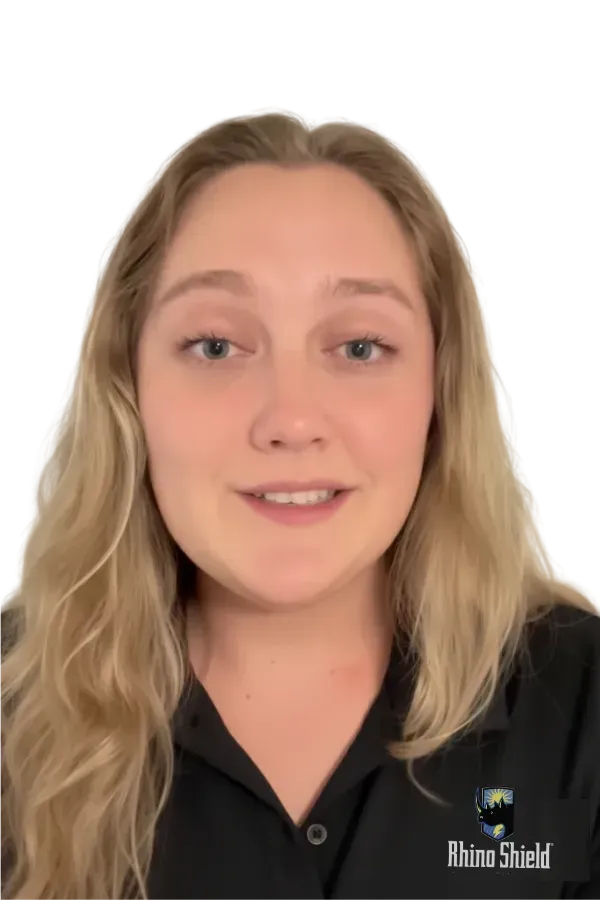 Person smiling in a black shirt against a plain white background