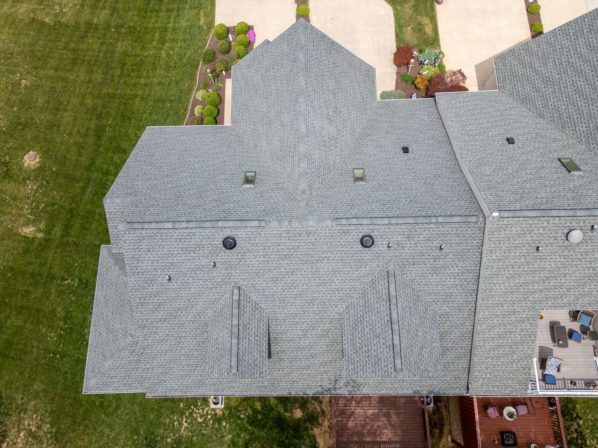 Overhead view of laminated architectural shingle courses on a home