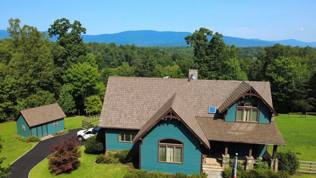 Brava composite roof with a mountain view behind the home