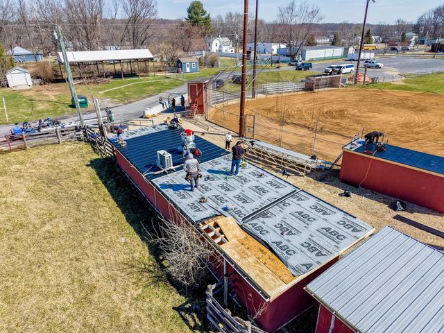 Baber crew roofing the Churchville baseball field dugouts