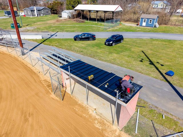 Metal roof going on a Churchville baseball dugout