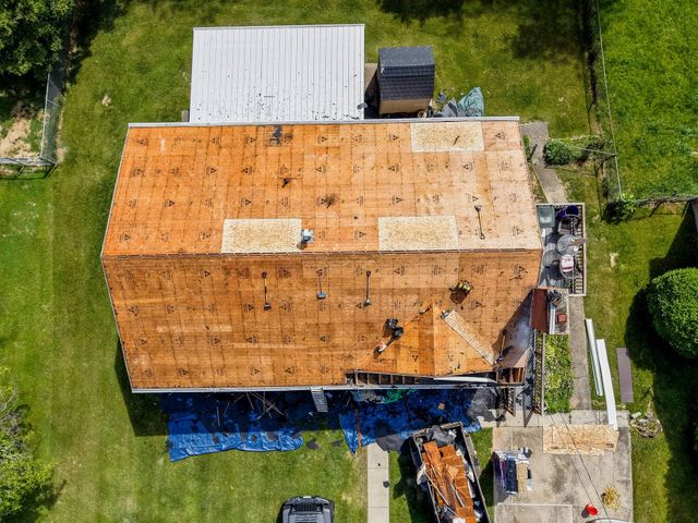 New roof decking going on during a Staunton roof replacement