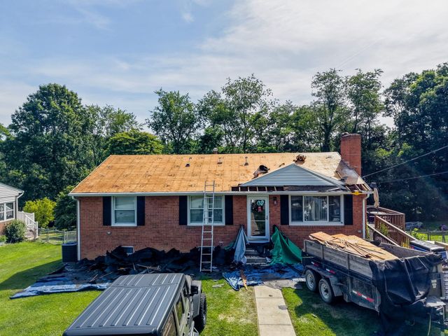 Roof replacement in progress on a brick ranch in Staunton, VA