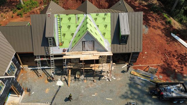 Underlayment going on during a roof installation