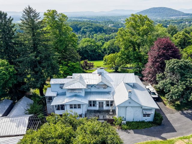 Standing seam metal roof in Staunton with the Blue Ridge behind it