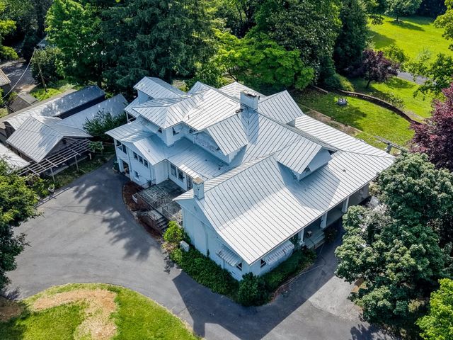 White standing seam metal roof on a large home in Staunton, VA