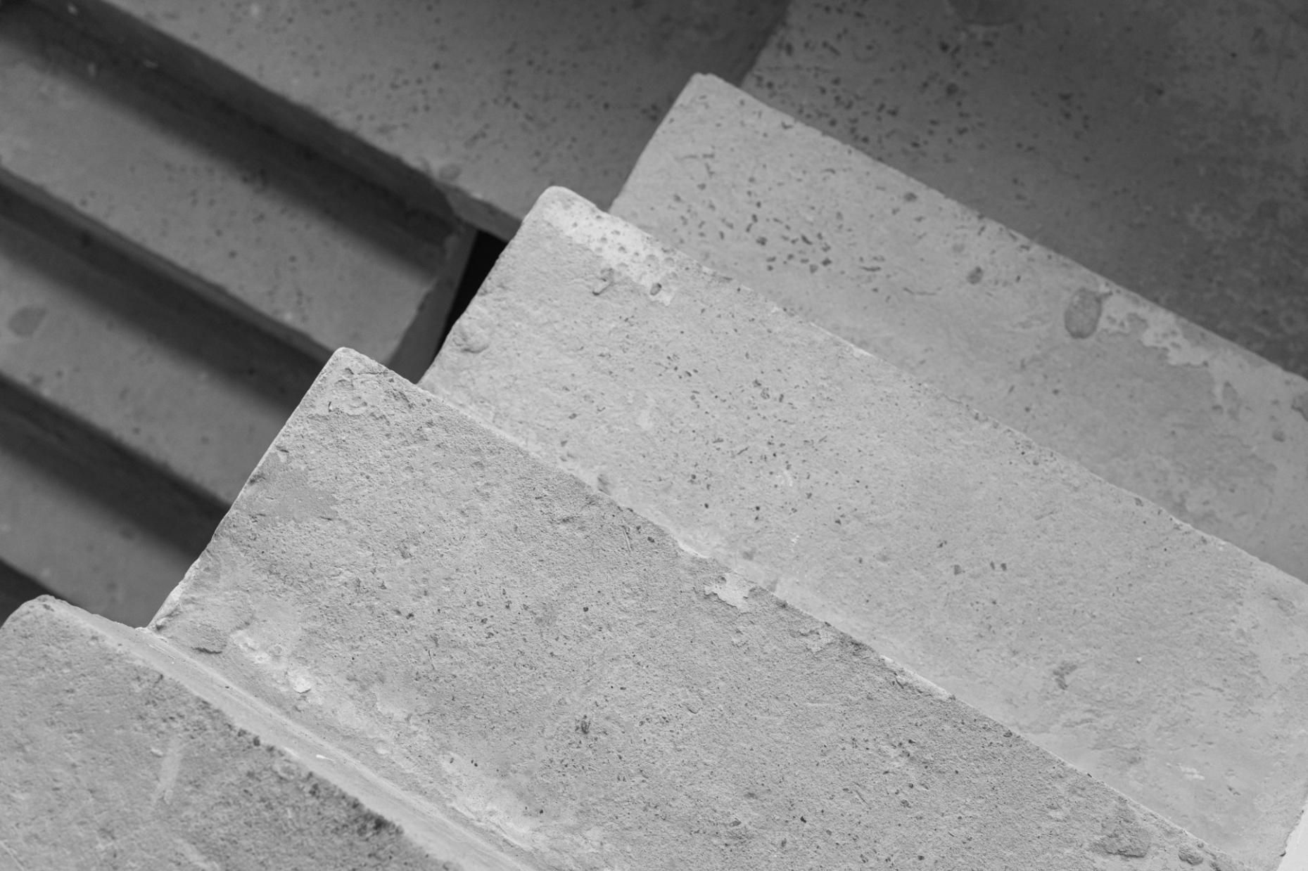 Concrete steps descending from an unseen point of origin.