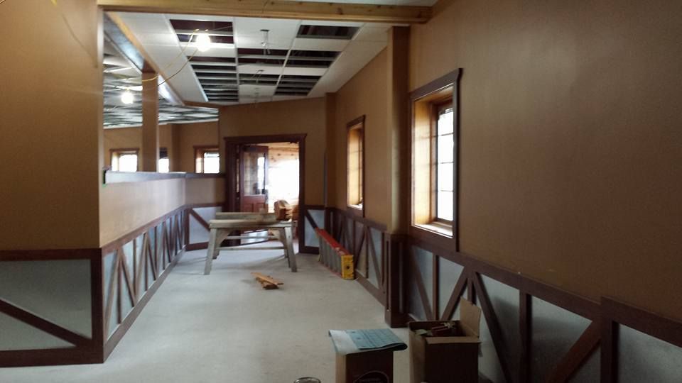 A restaurant with new drywall and acoustic ceiling installed