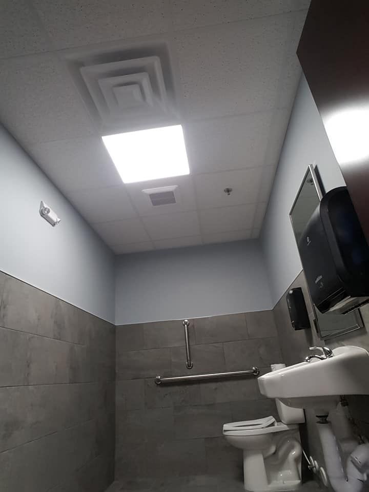 bathroom acoustic ceiling installation in a bathroom