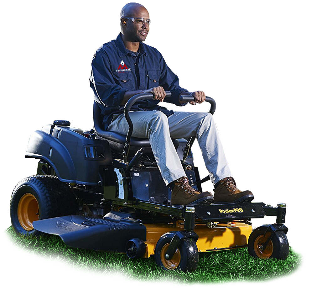 Man seated on a black and yellow riding lawnmower, operating it on a grassy area.