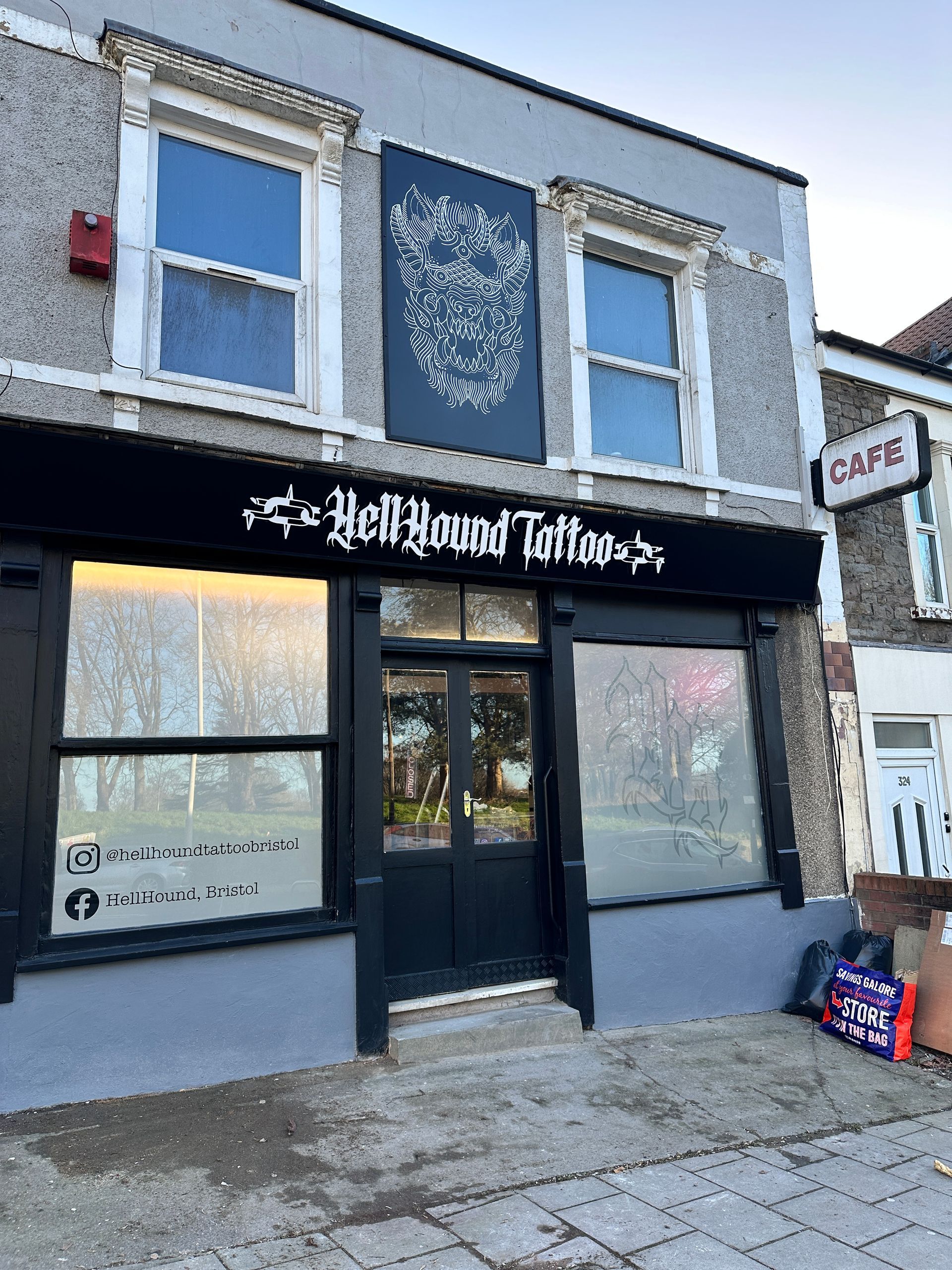 A building with a sign that says bellhound tattoo on it