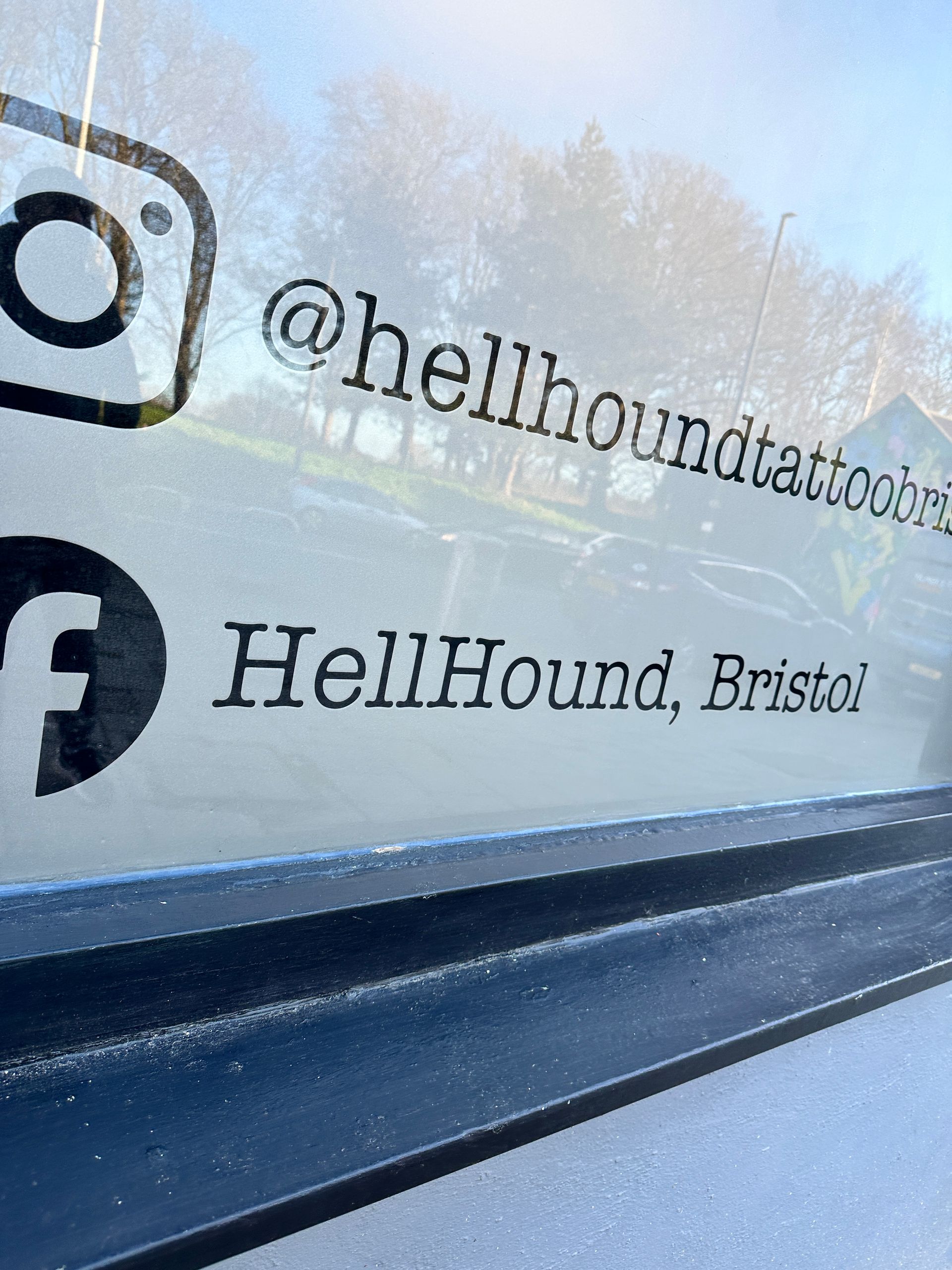 A close up of a sign that says hellhound bristol