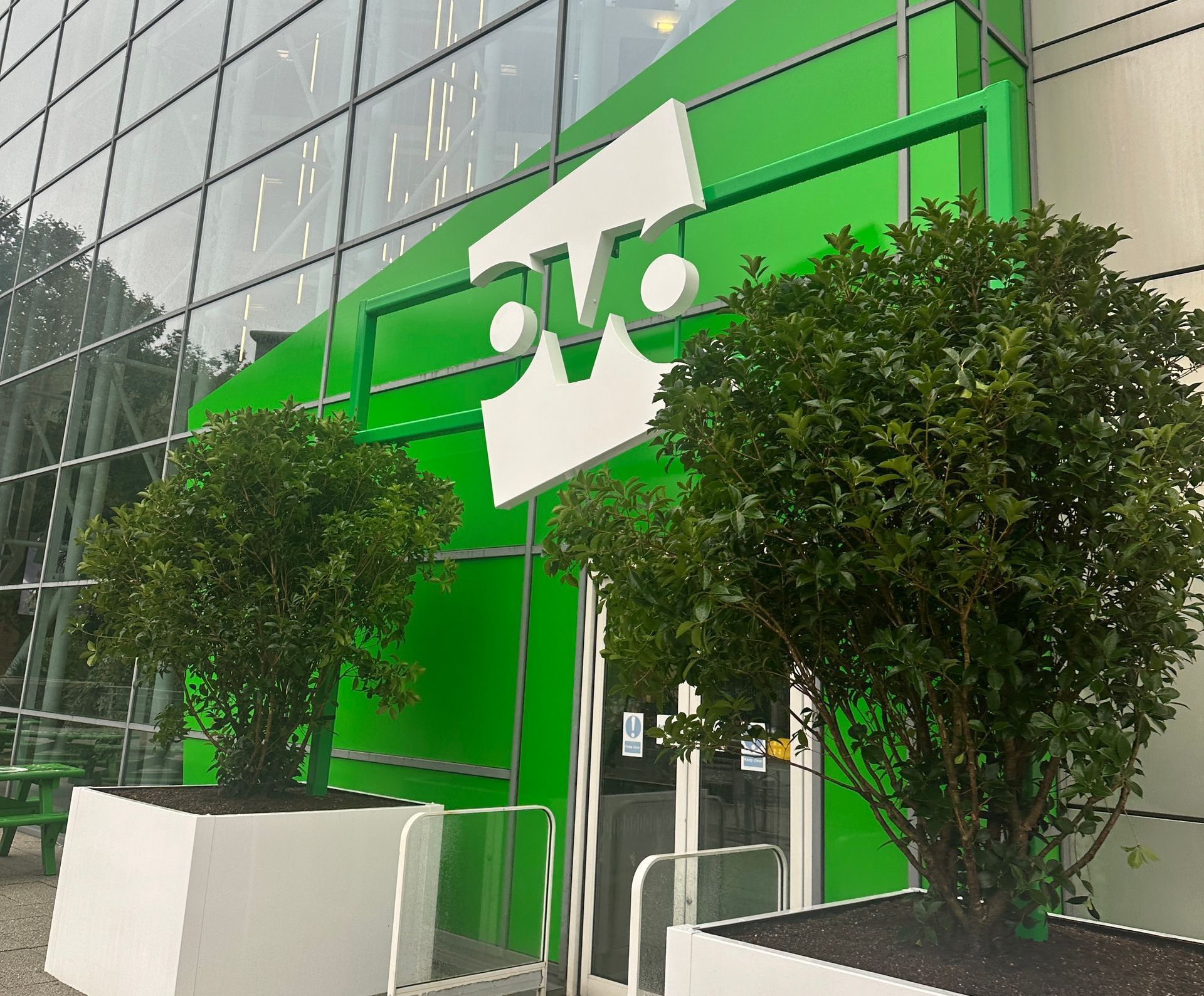 N3 Display Graphics | A green building with a white t on it