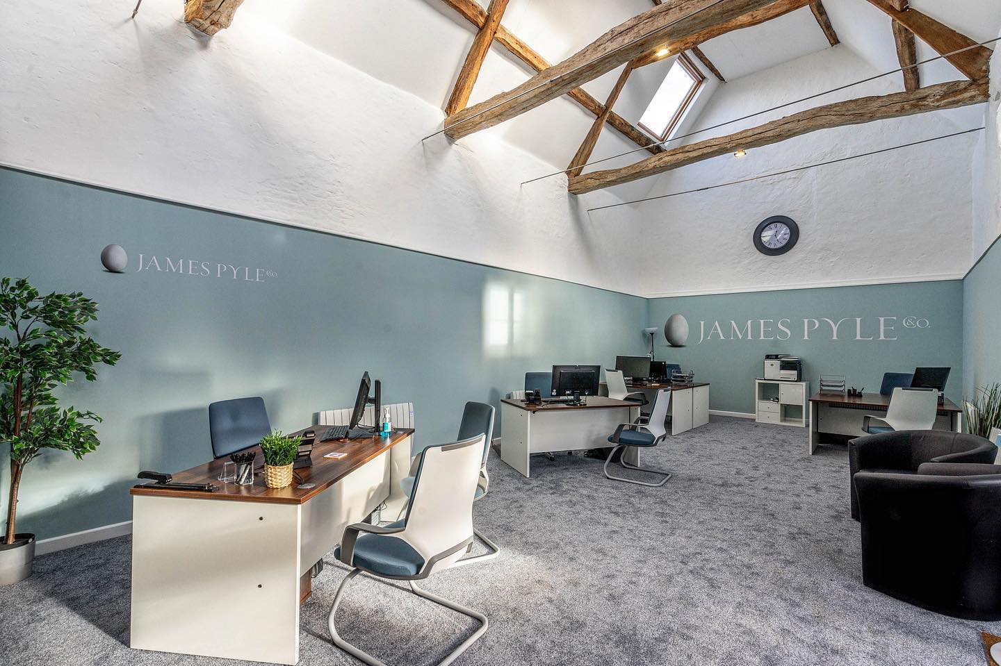 A large office with a lot of desks and chairs