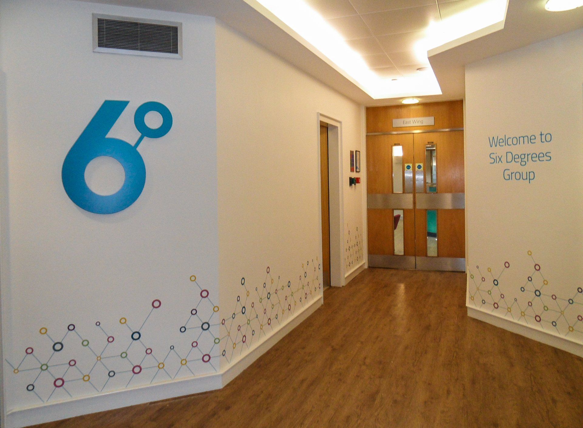 A hallway with the number 6 on the wall
