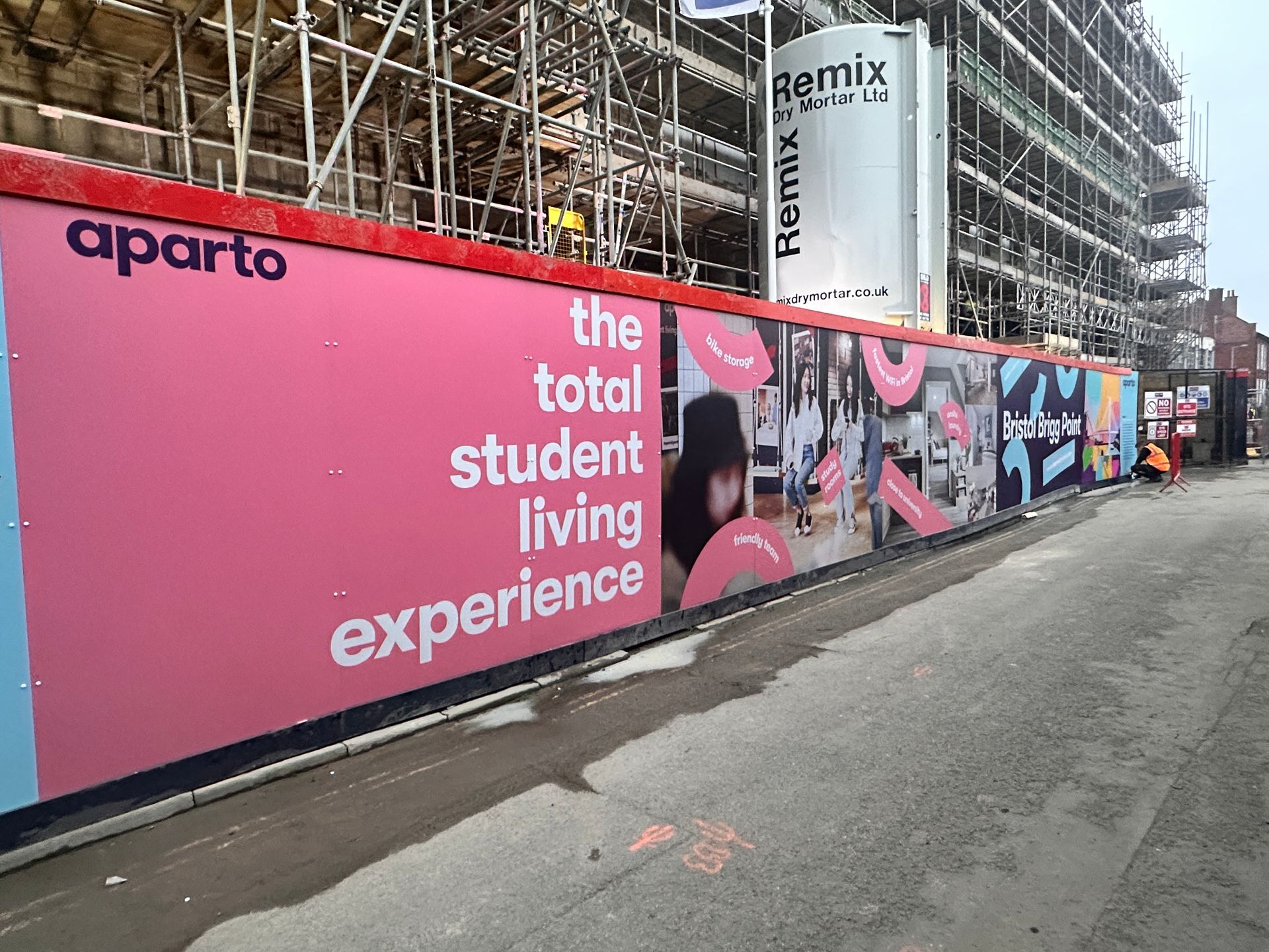 N3 Display Graphics | A construction site with a sign that says the total student living experience