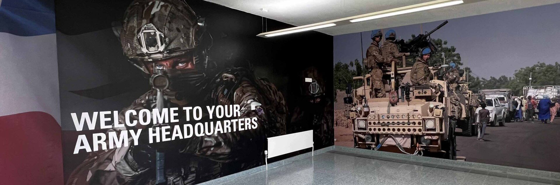 A sign that says welcome to your army headquarters
