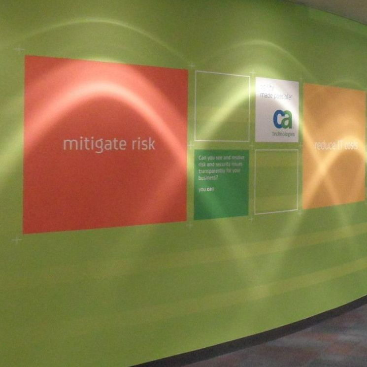A green wall with a sign that says mitigate risk