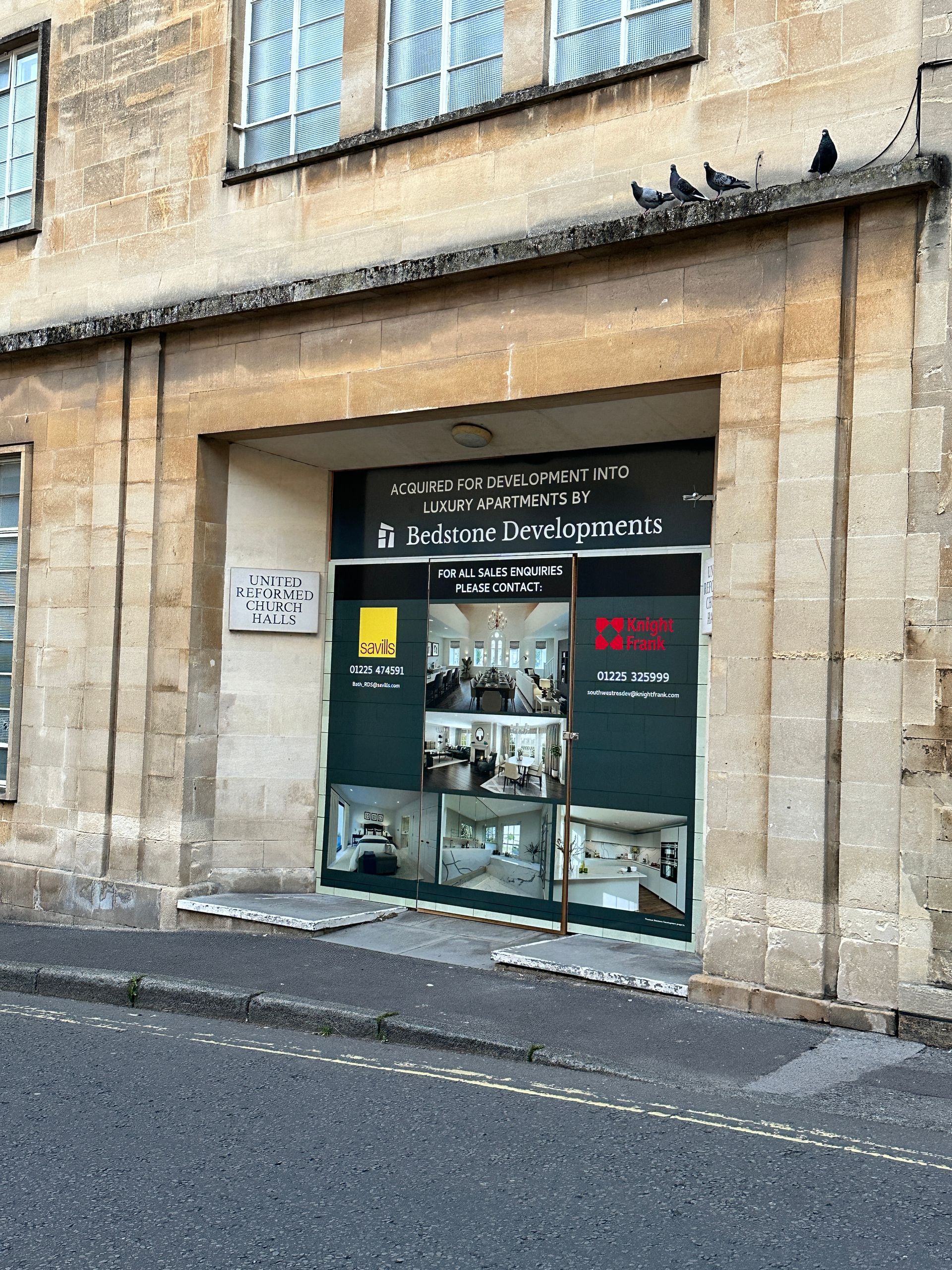 A building with a sign that says for sale on it