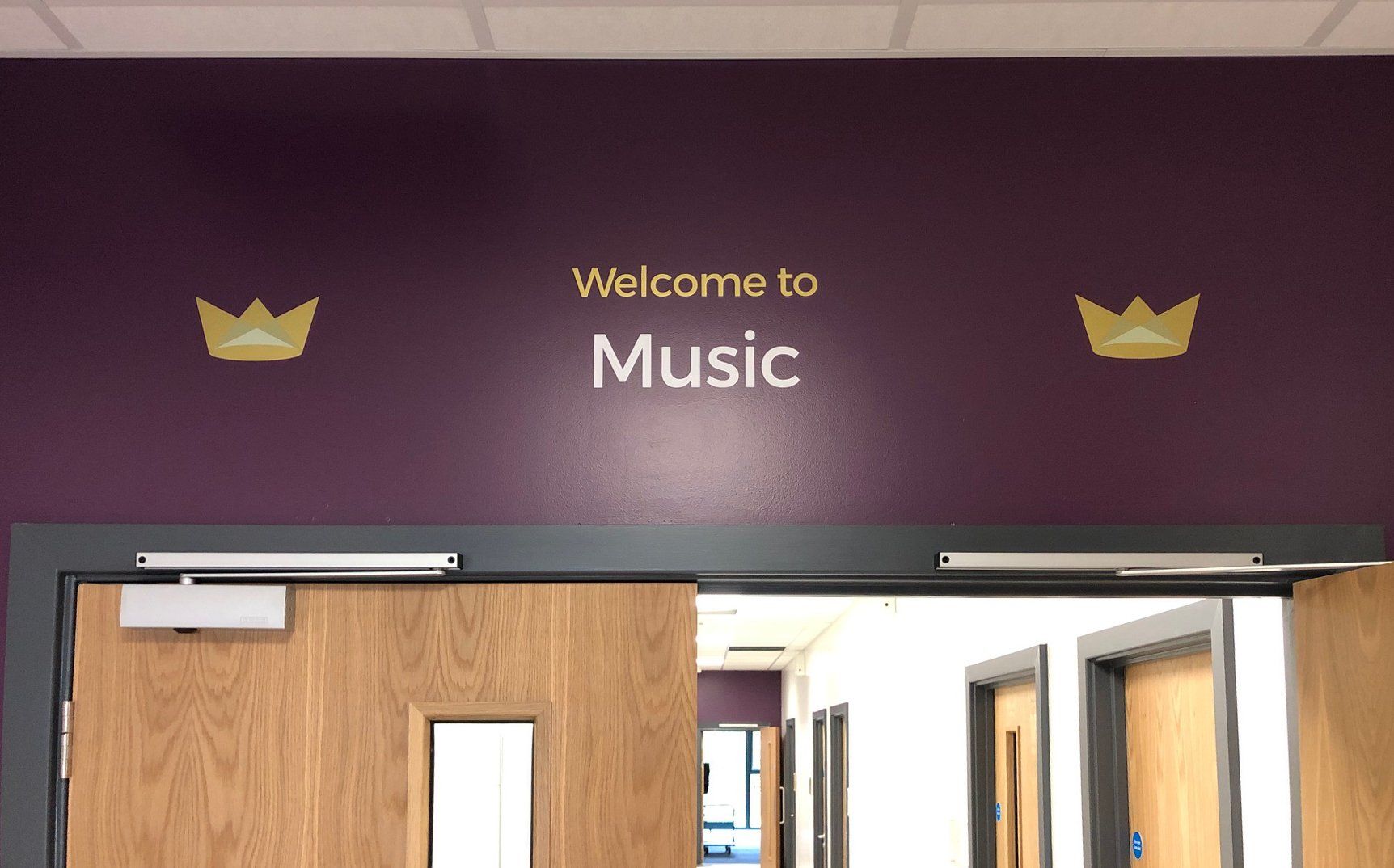A purple wall with the words welcome to music on it