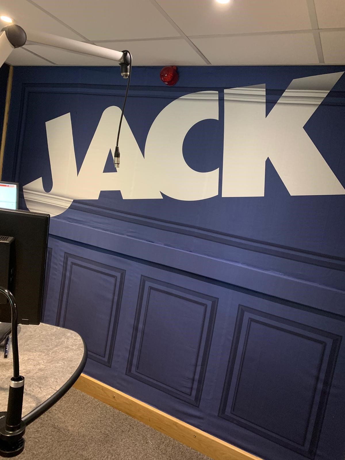A blue wall with the word jack painted on it