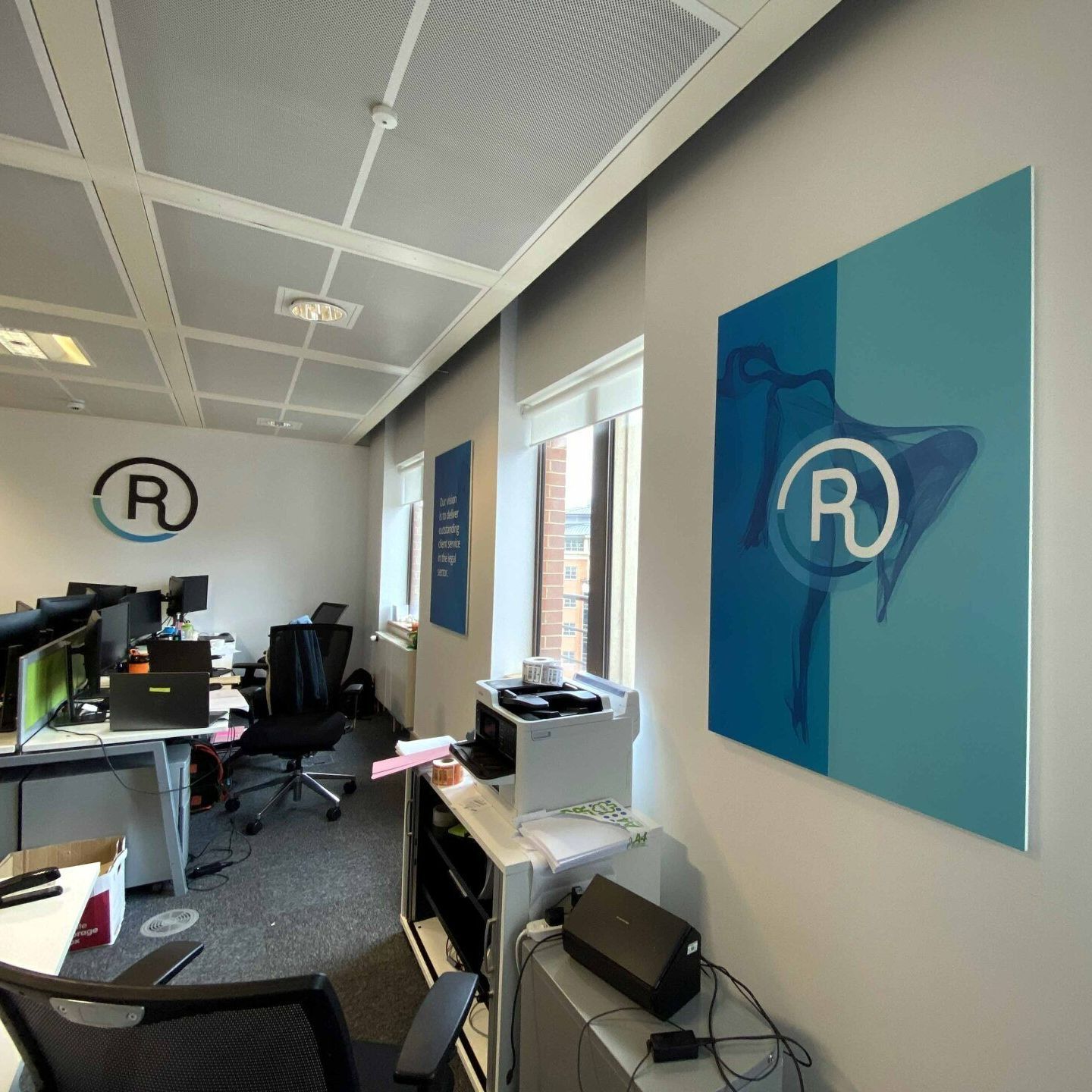 An office with a picture of a bird with the letter r on it
