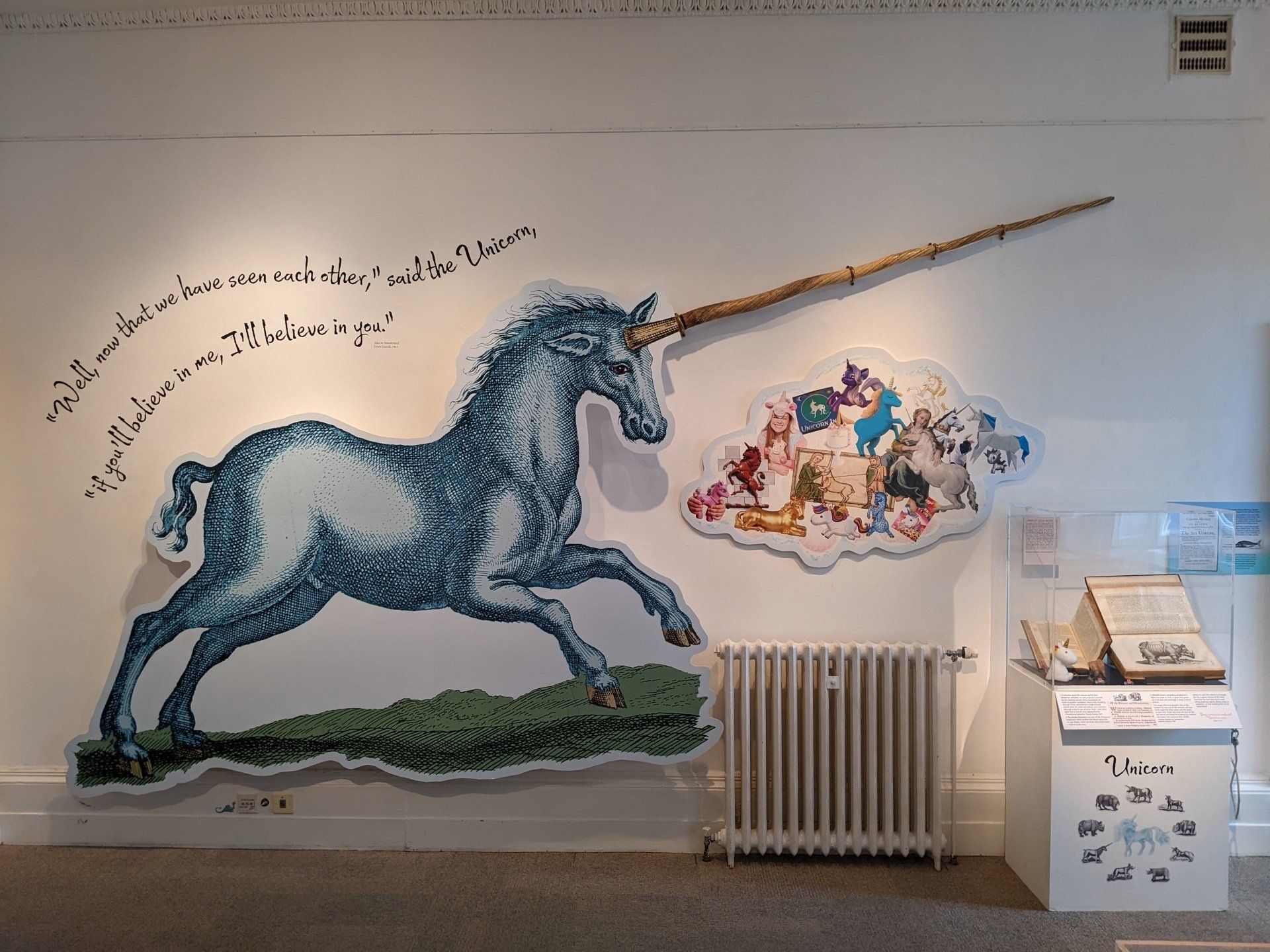 A painting of a unicorn on a white wall