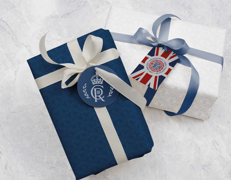 Two gifts wrapped in blue and white with a tag that says r on it