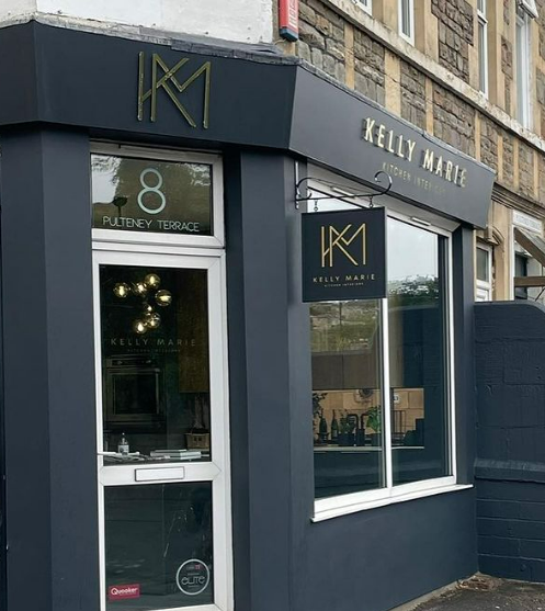 A store front with a sign that says kelly marie