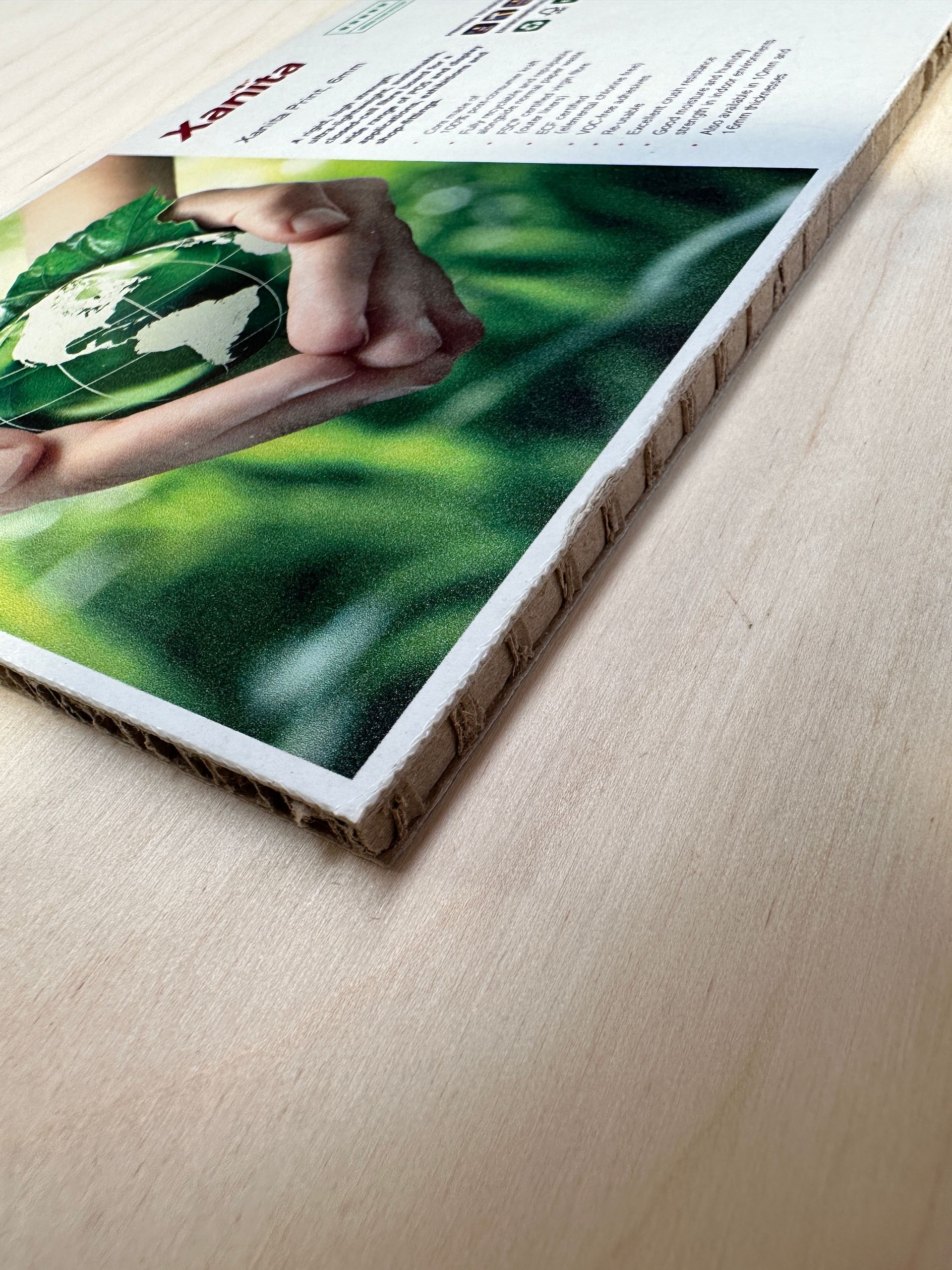 A cardboard box with a picture of a person holding a globe