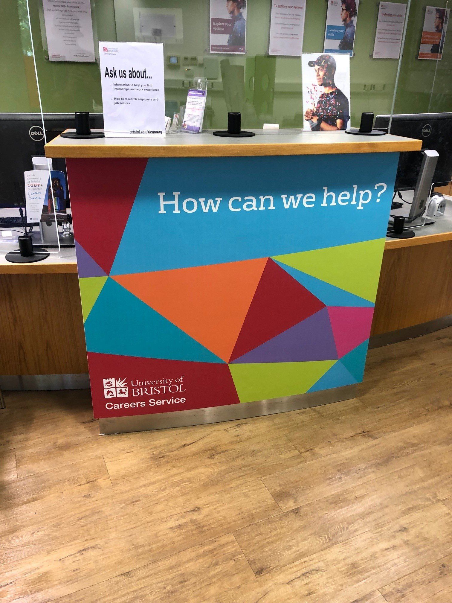 A colorful counter with the words `` how can we help '' on it