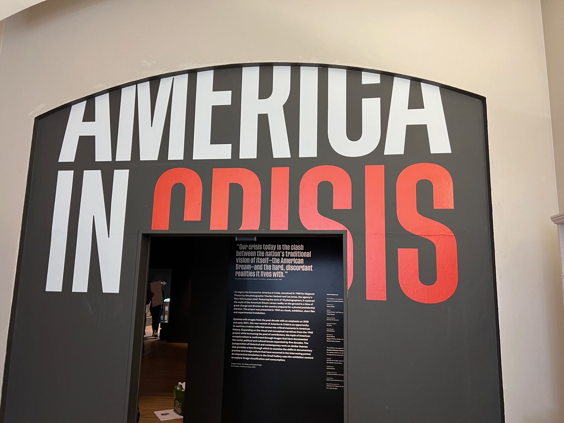 A sign that says america in crisis on it
