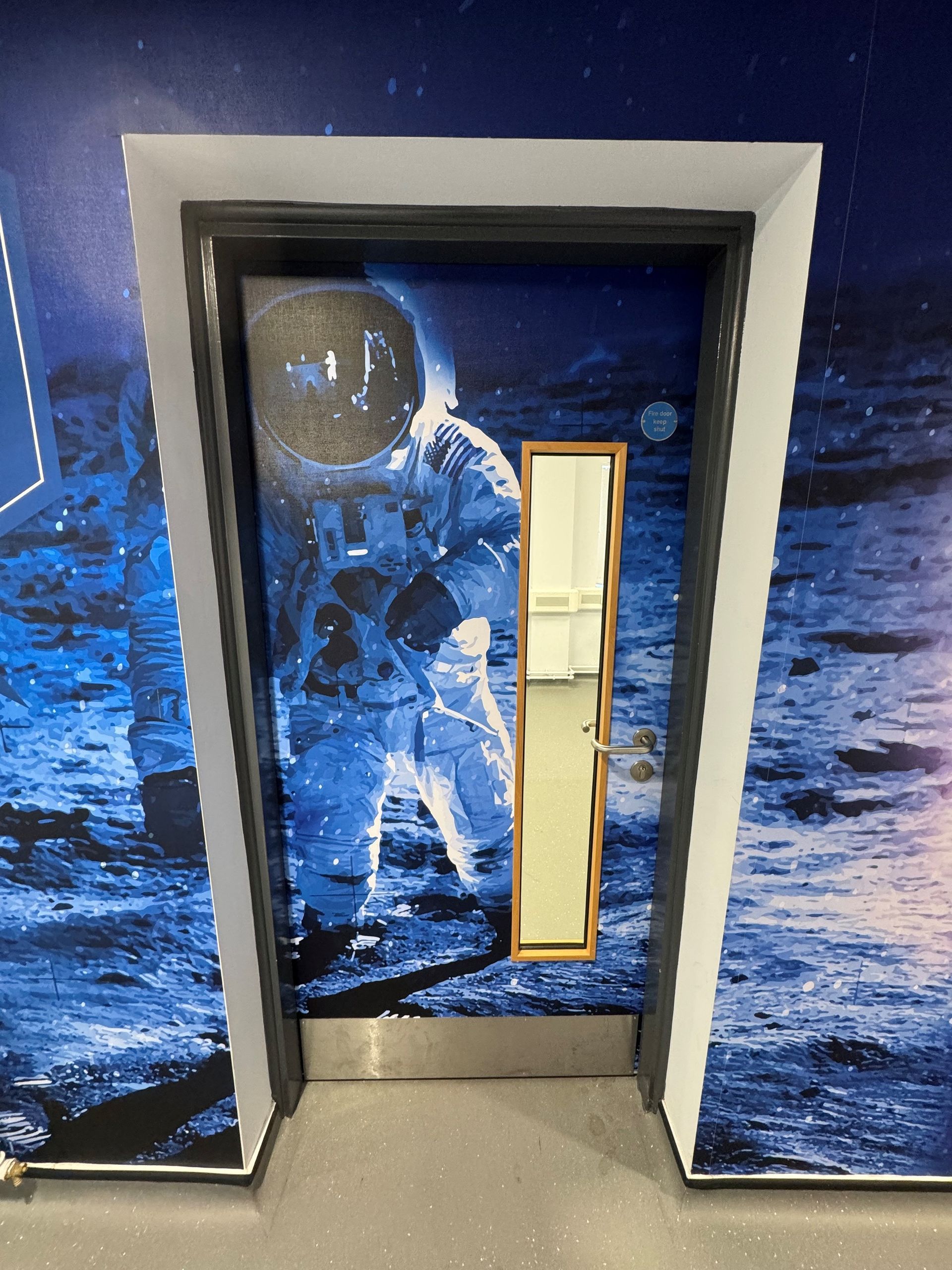 A door with a picture of an astronaut on it