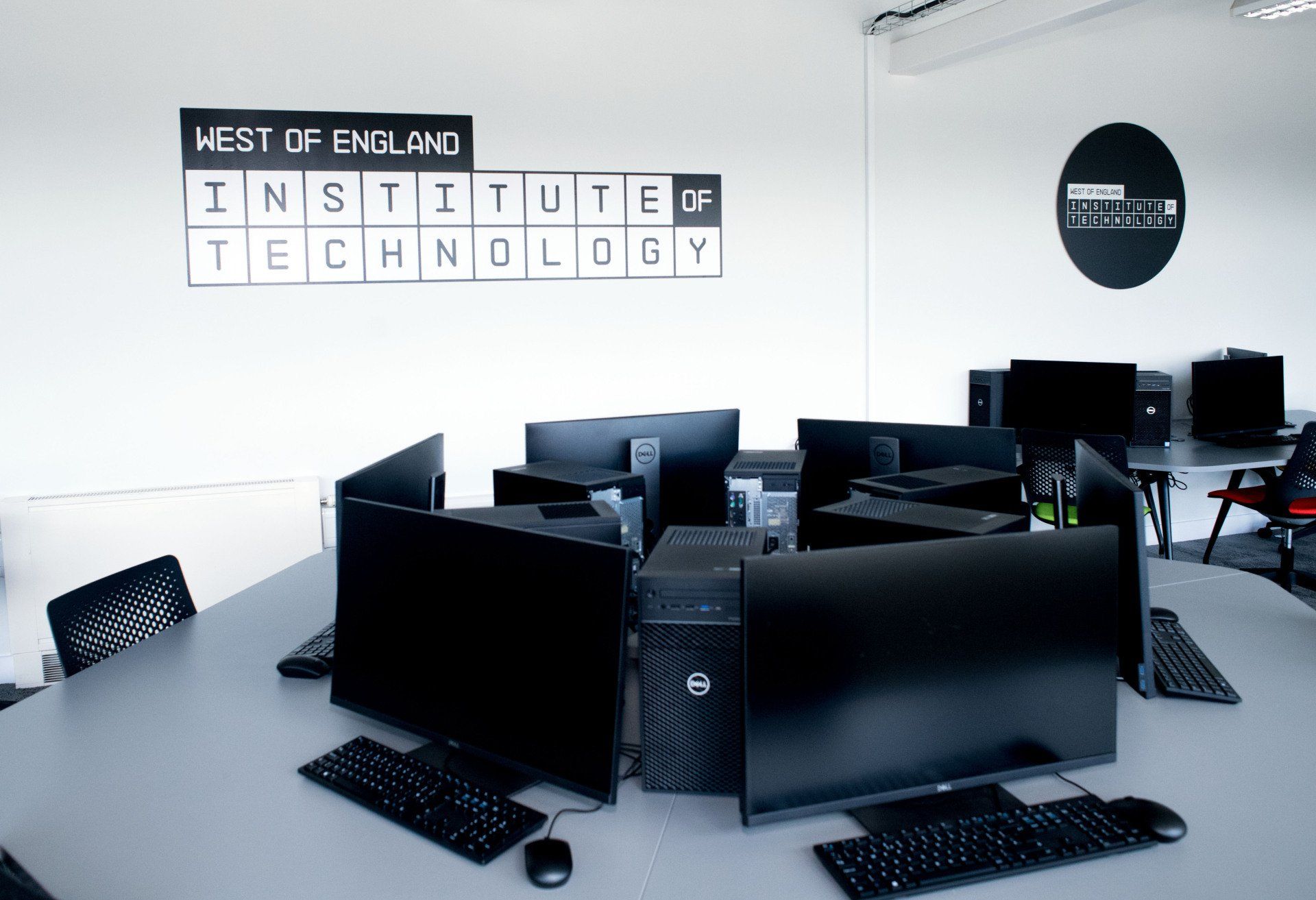 A room with a sign that says west of england institute of technology