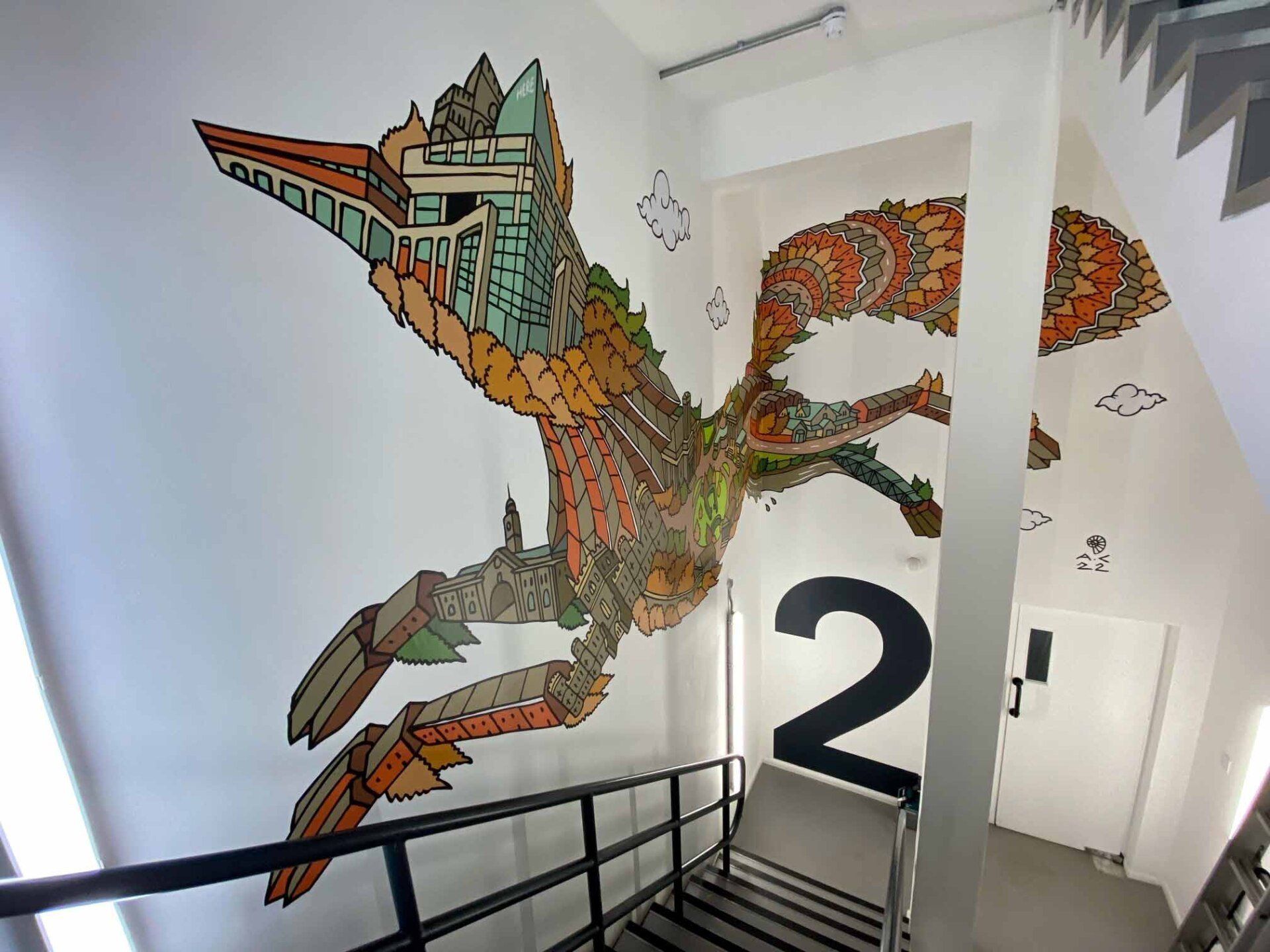 A staircase with a painting of a bird and the number 2 on the wall