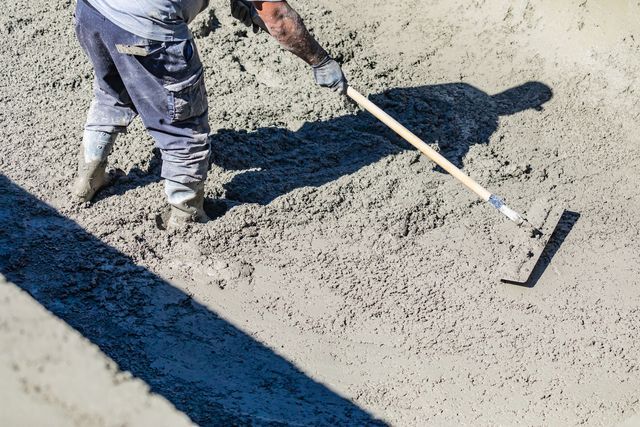 smoothing concrete after pour for a southern md concrete project.