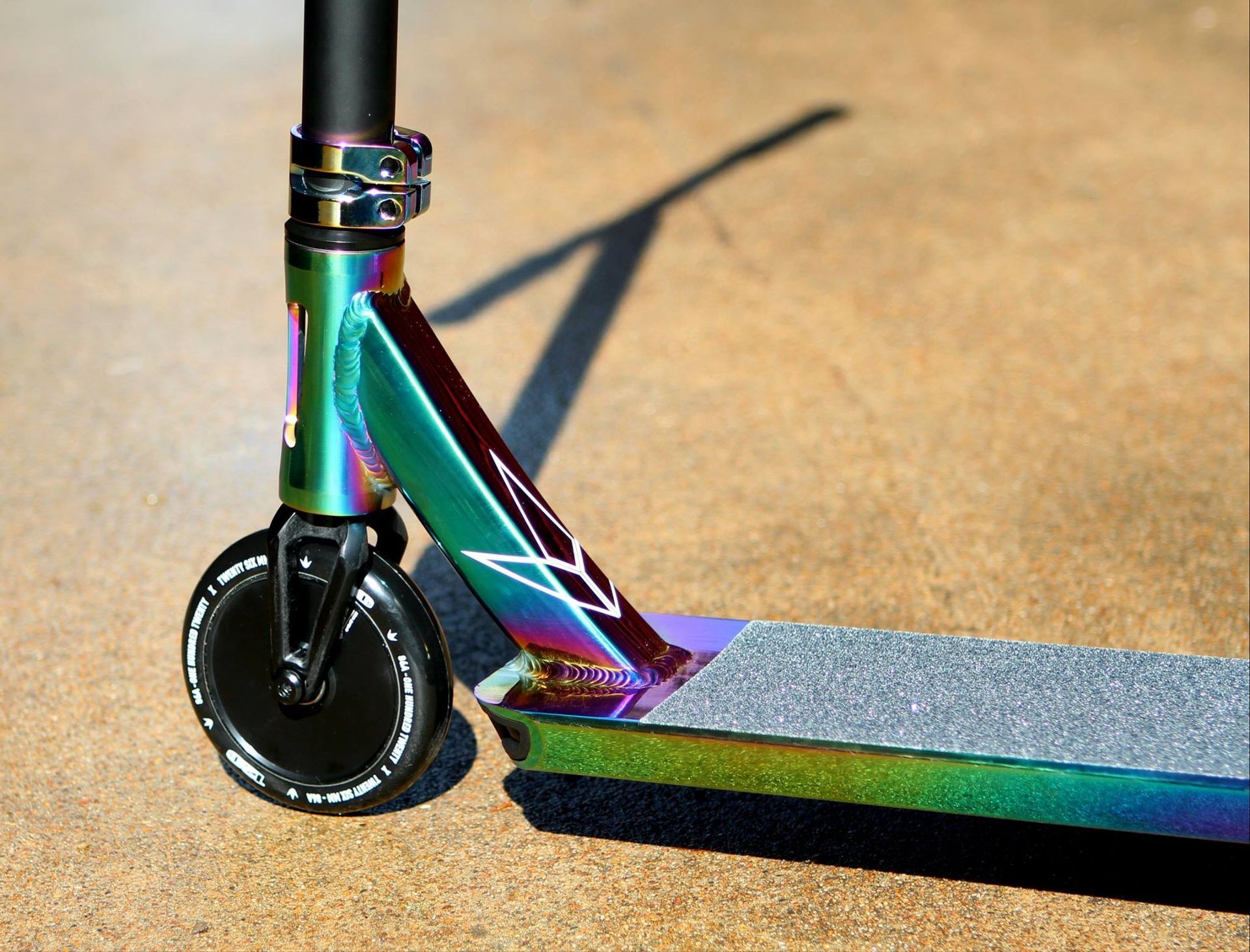 A Person Is Riding An Electric Scooter On A Brick Sidewalk — Active Cycles In Raymond Terrace, NSW