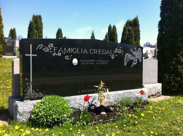 Black granite headstone with family name