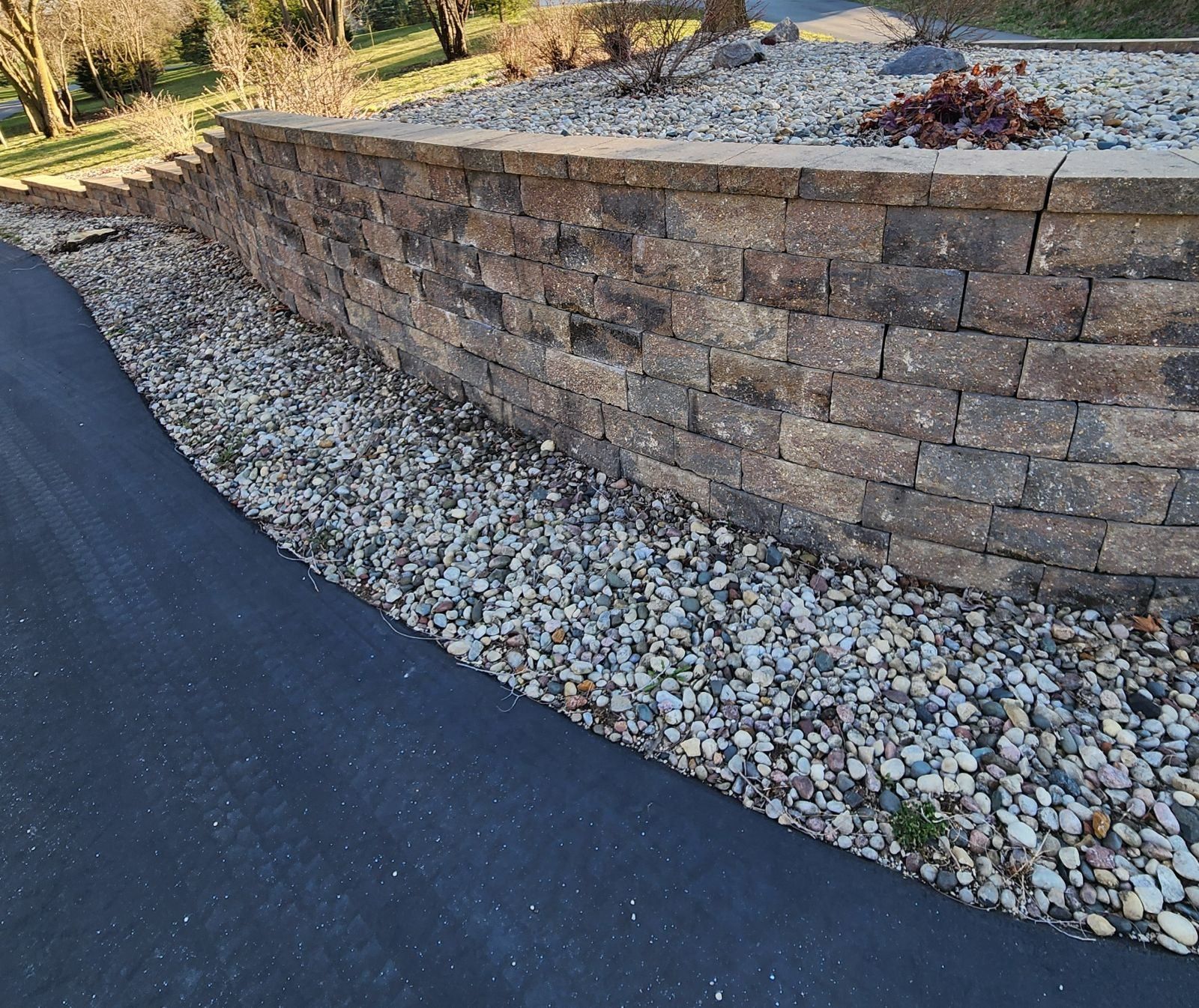 Retaining wall spring cleanup and repair in Janesville WI by Malterer’s Landscaping & Lawn Care.