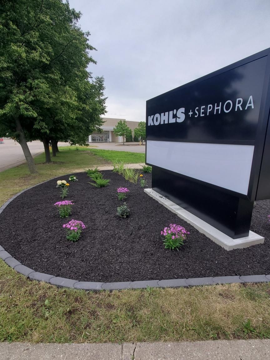 Finished commercial landscape renovation around the Kohl’s and Sephora sign in Janesville, Wisconsin