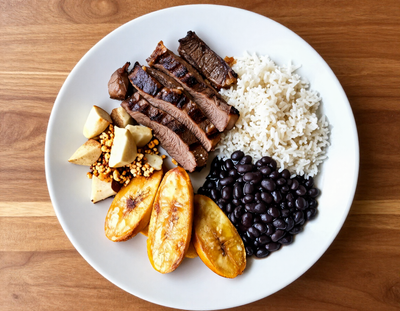 Brazilian and Cuban plate with rice, beans and plantains from a Lake Norman food truck