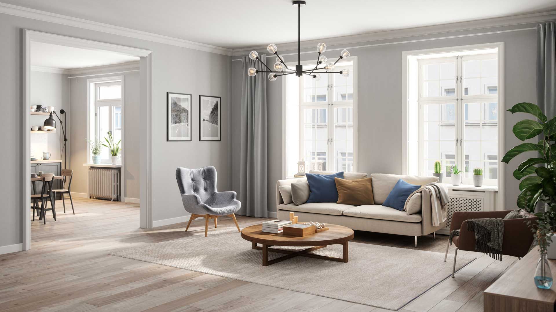 Living room with neutral color scheme, featuring sofa, armchair, coffee table, and large windows.