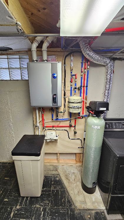Basement utility area with water heater, electrical panel, pipes, and air filtration system.