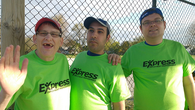 Three people in green