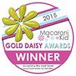 A gold daisy award winner badge with a yellow flower on it.