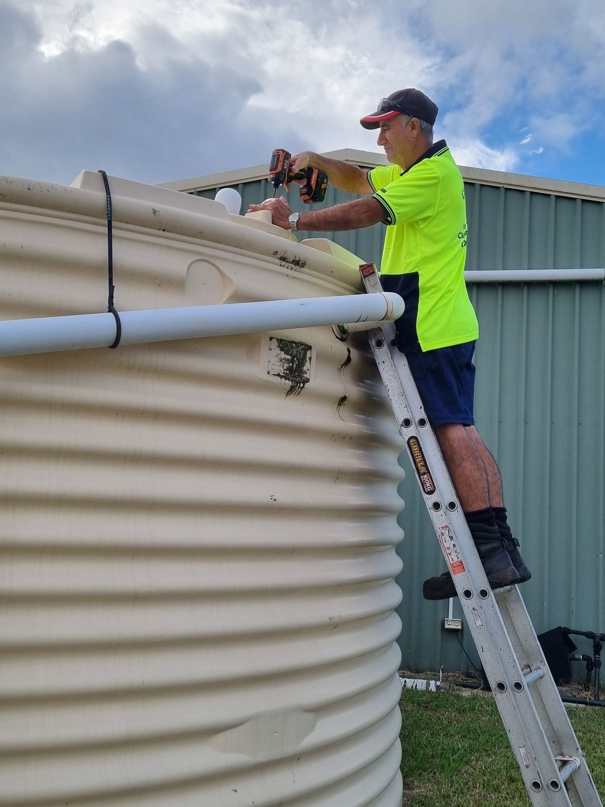 A Bunch Of Pipes And Wires Are Laying On The Ground — Clear and Clean Water Tank Cleaning Services in Bridgman, NSW