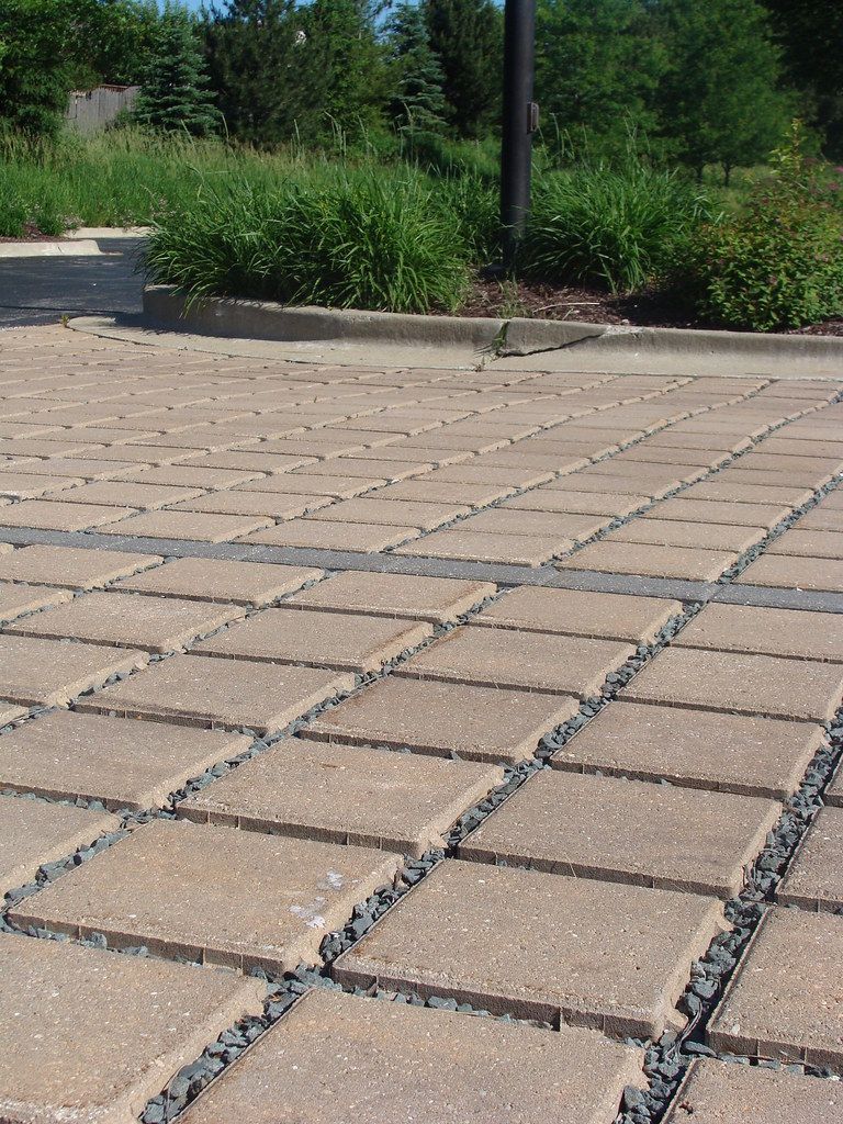 A floor being leveled with a spiked roller.