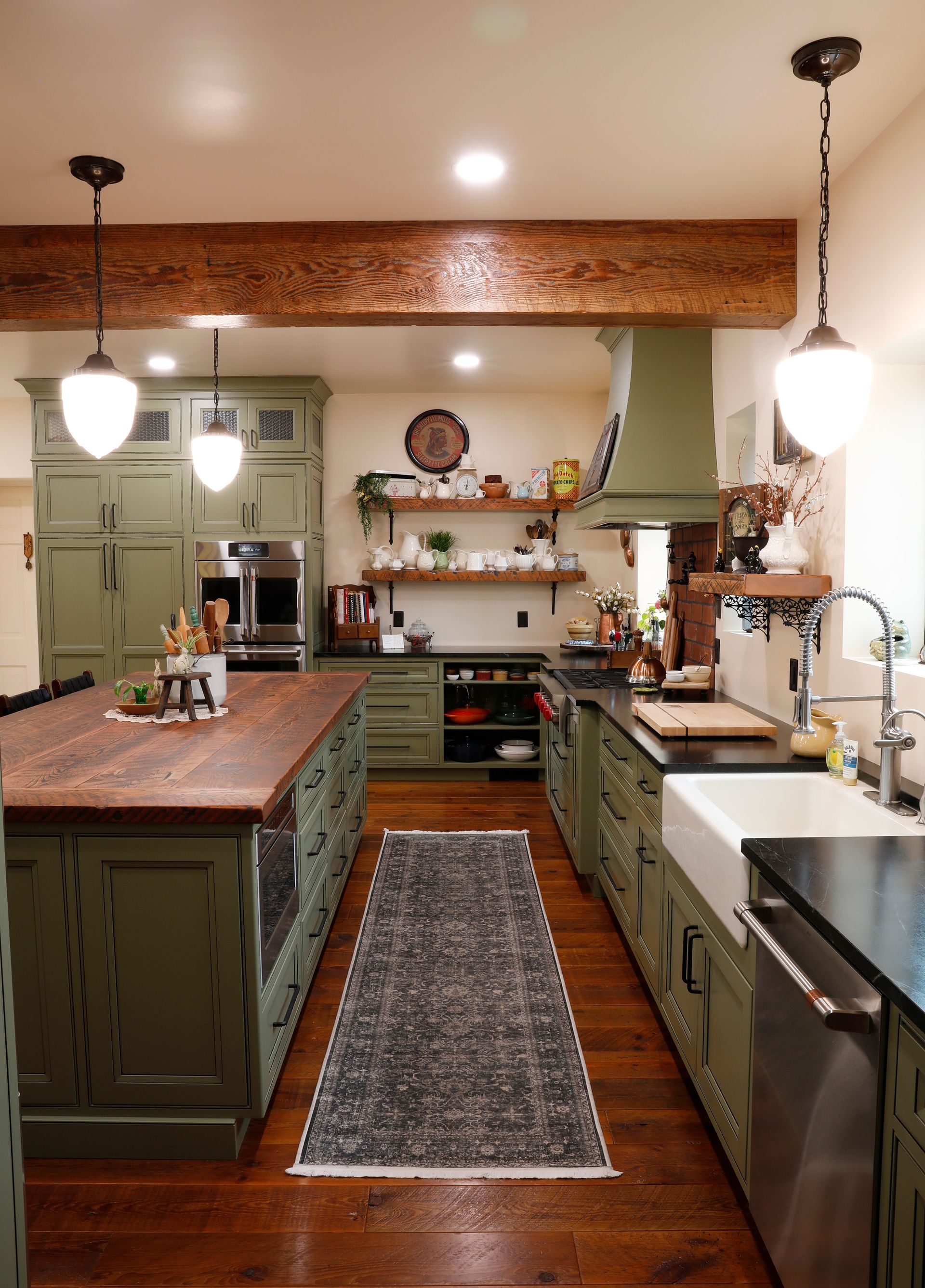 Spacious kitchen with wood cabinets, granite countertops, and a large island.
