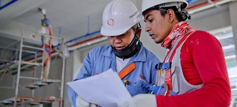 two engineers discussing achieving net-zero energy consumption